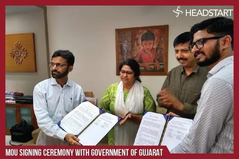 Nikunj and Headstart team members exchanging signed MoU documents with Government of Gujarat officials
